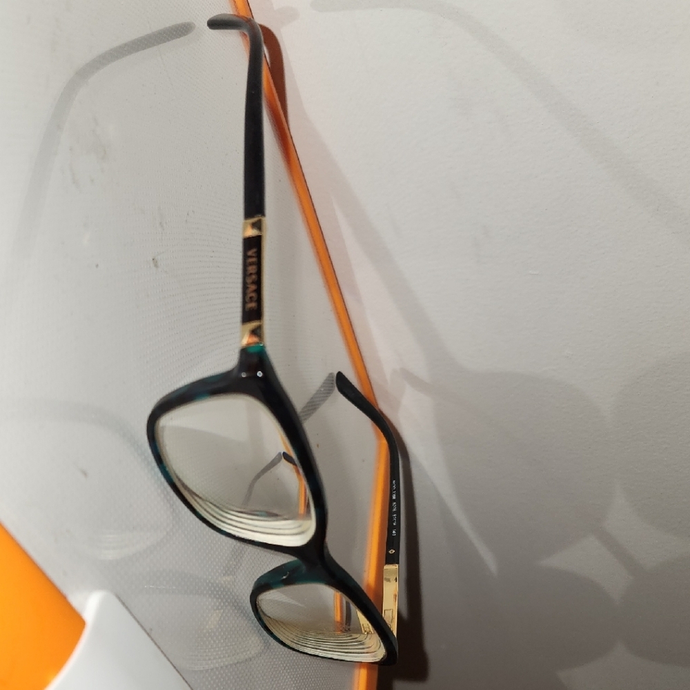 Versace Black and Gold Cat-Eye Glasses with Sleek Design